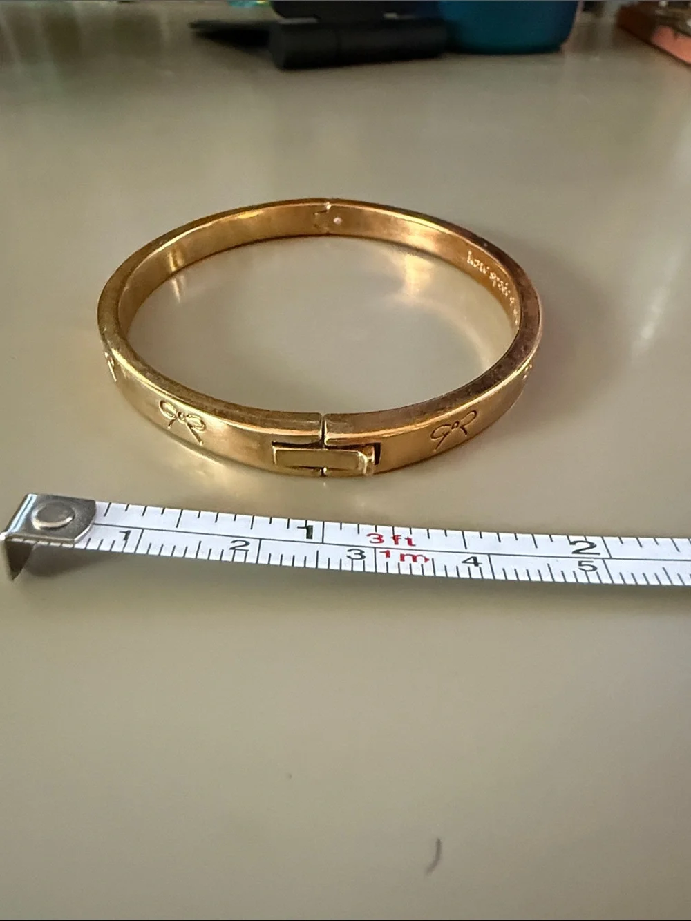 kate spade Gold Bow-Embossed Bangle Bracelet